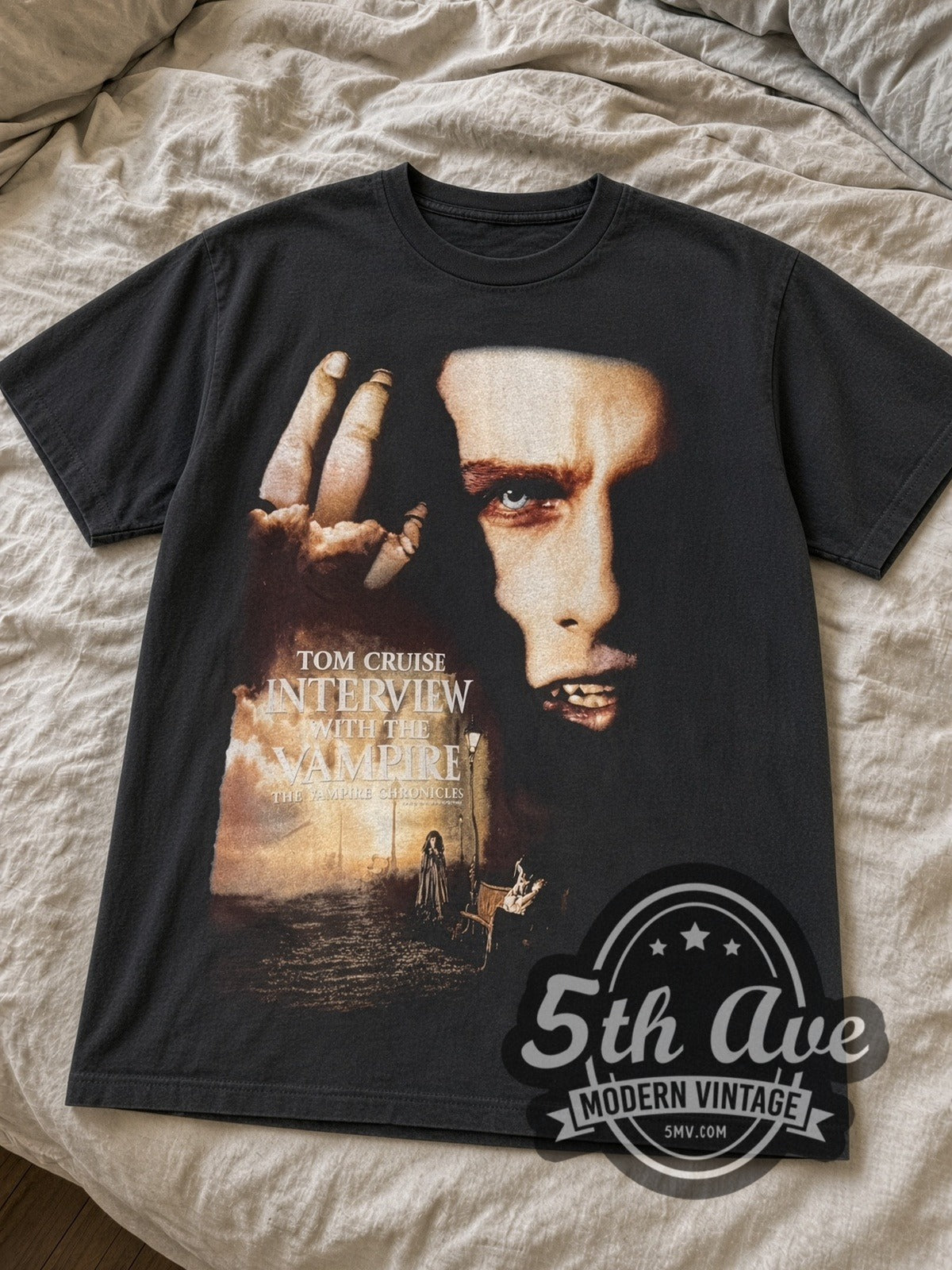 Black Interview with the Vampire tee laid flat on linen bed