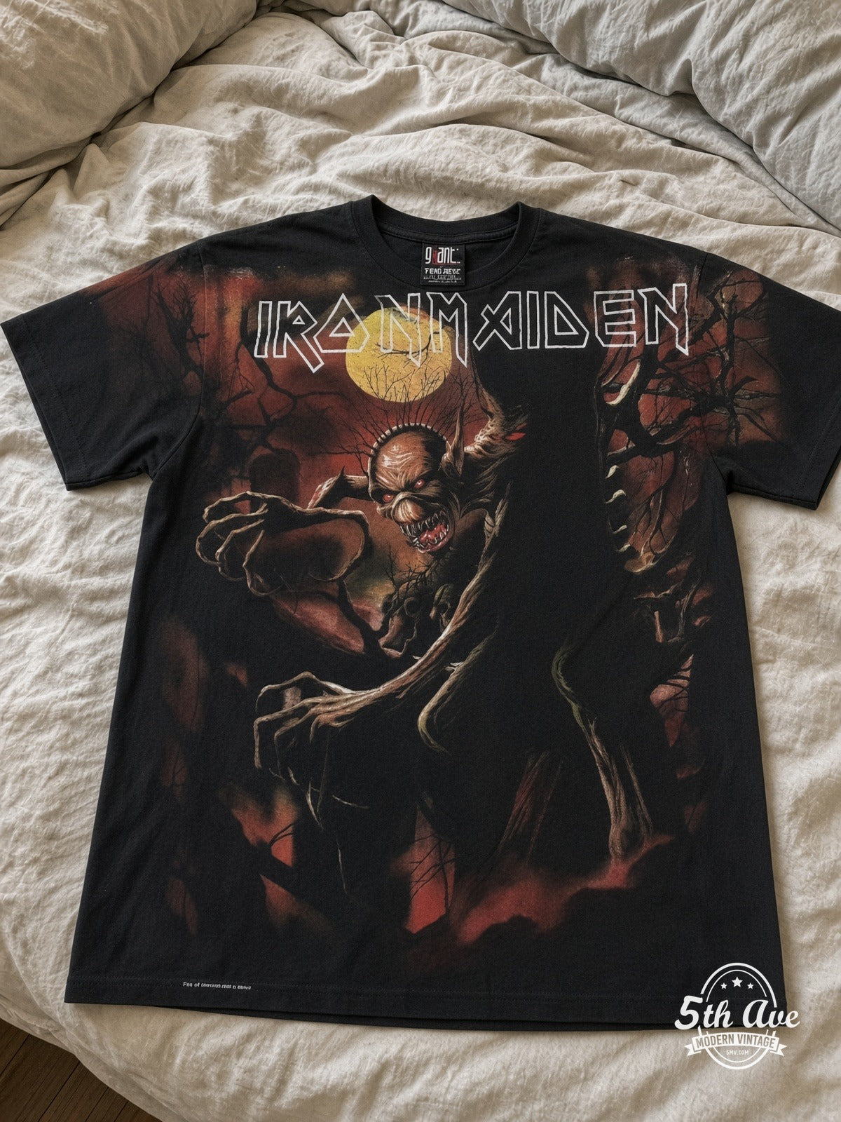 Iron Maiden Fear of the Dark Tree Eddie Black all over print vintage tee laid on bed