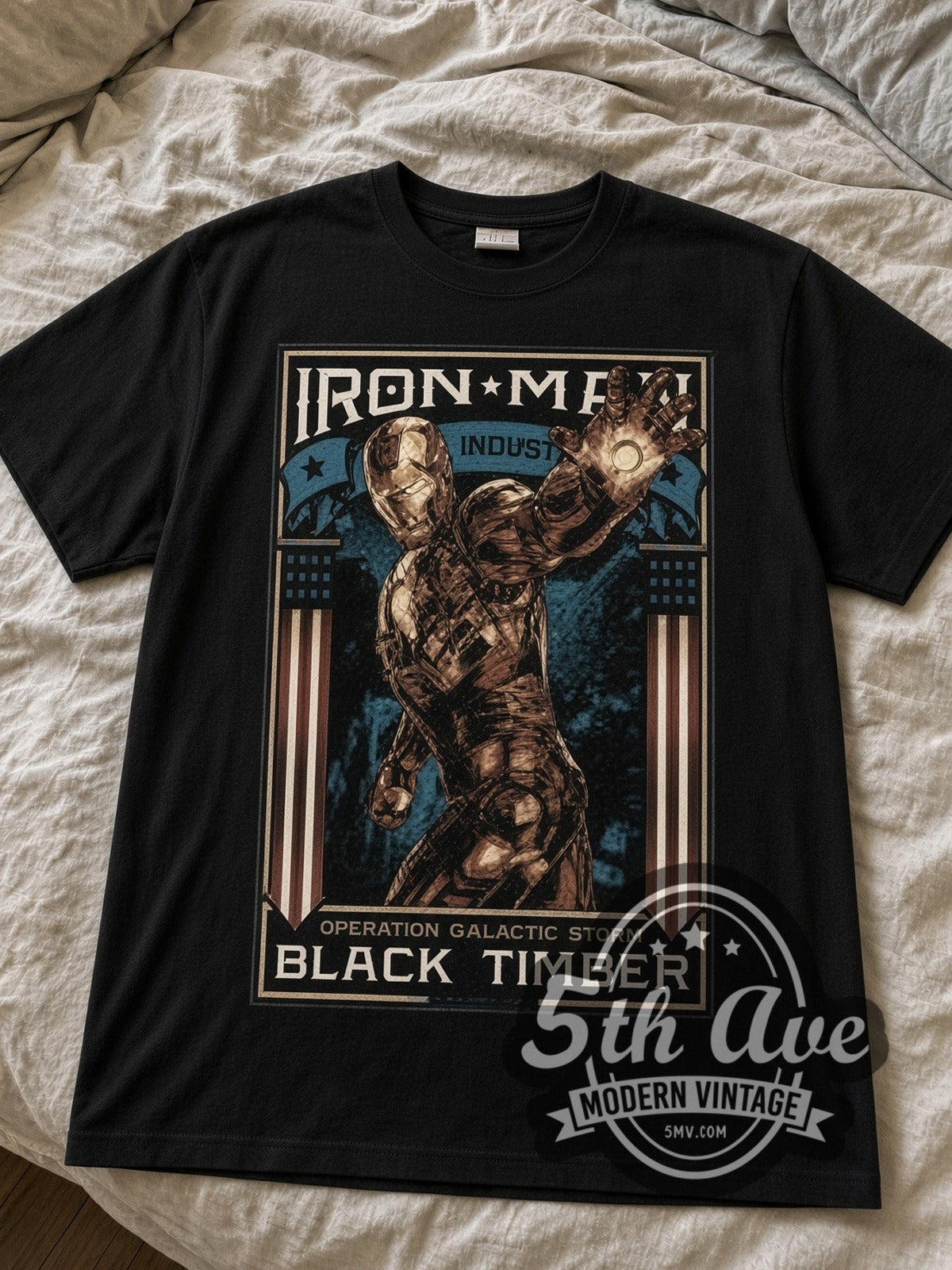 Iron Man Operation Galactic Storm Frame black graphic tee laid flat on linen bed