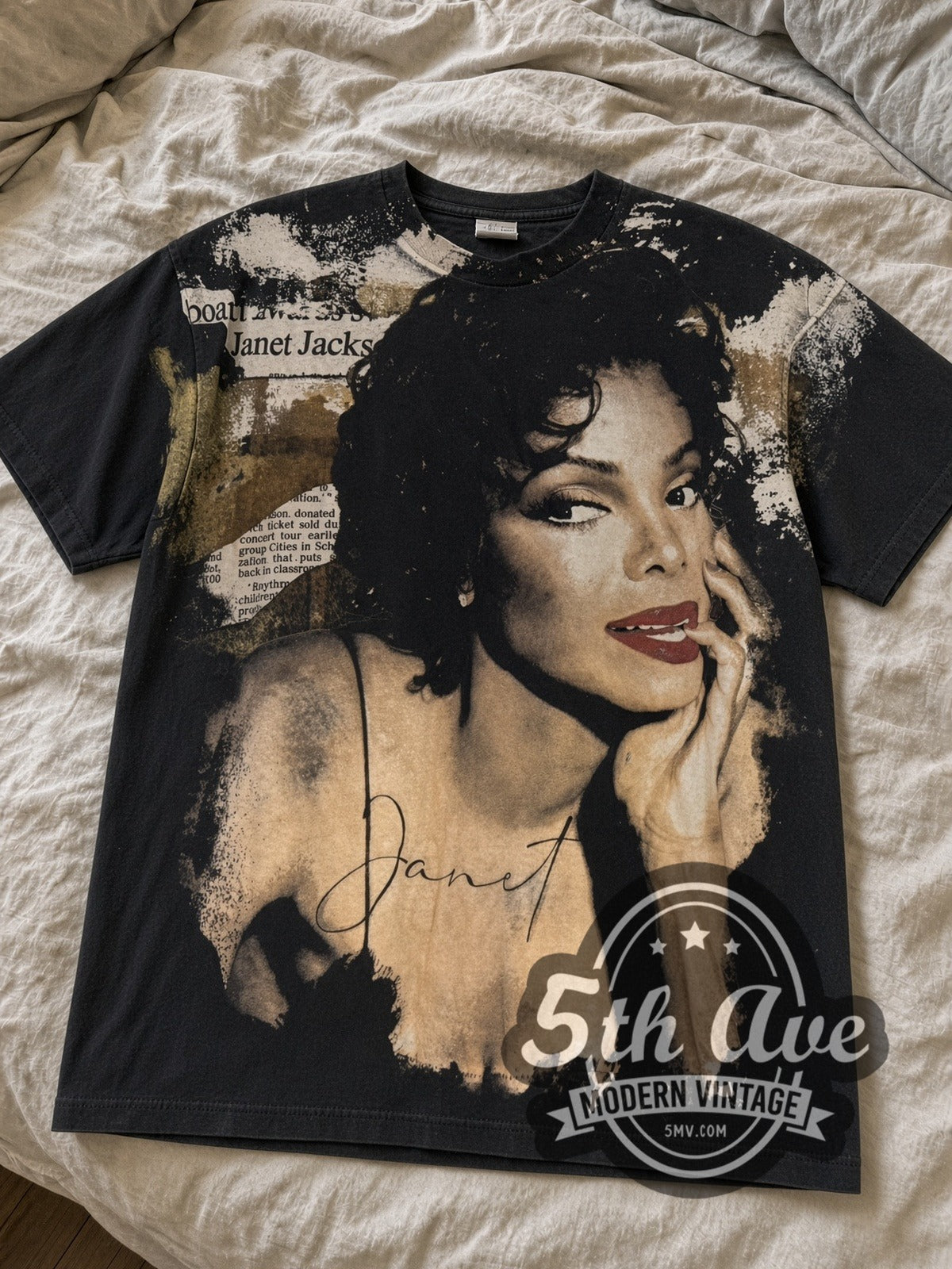 Black Janet Jackson all over print tee laid flat on linen bed
