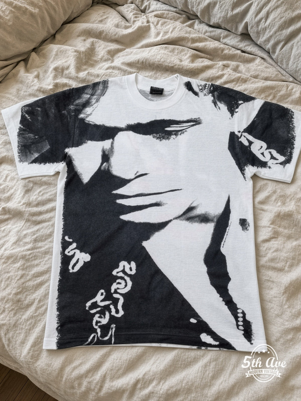 John Mellencamp Whenever We Wanted Tour 1992 White all over print vintage tee laid on bed