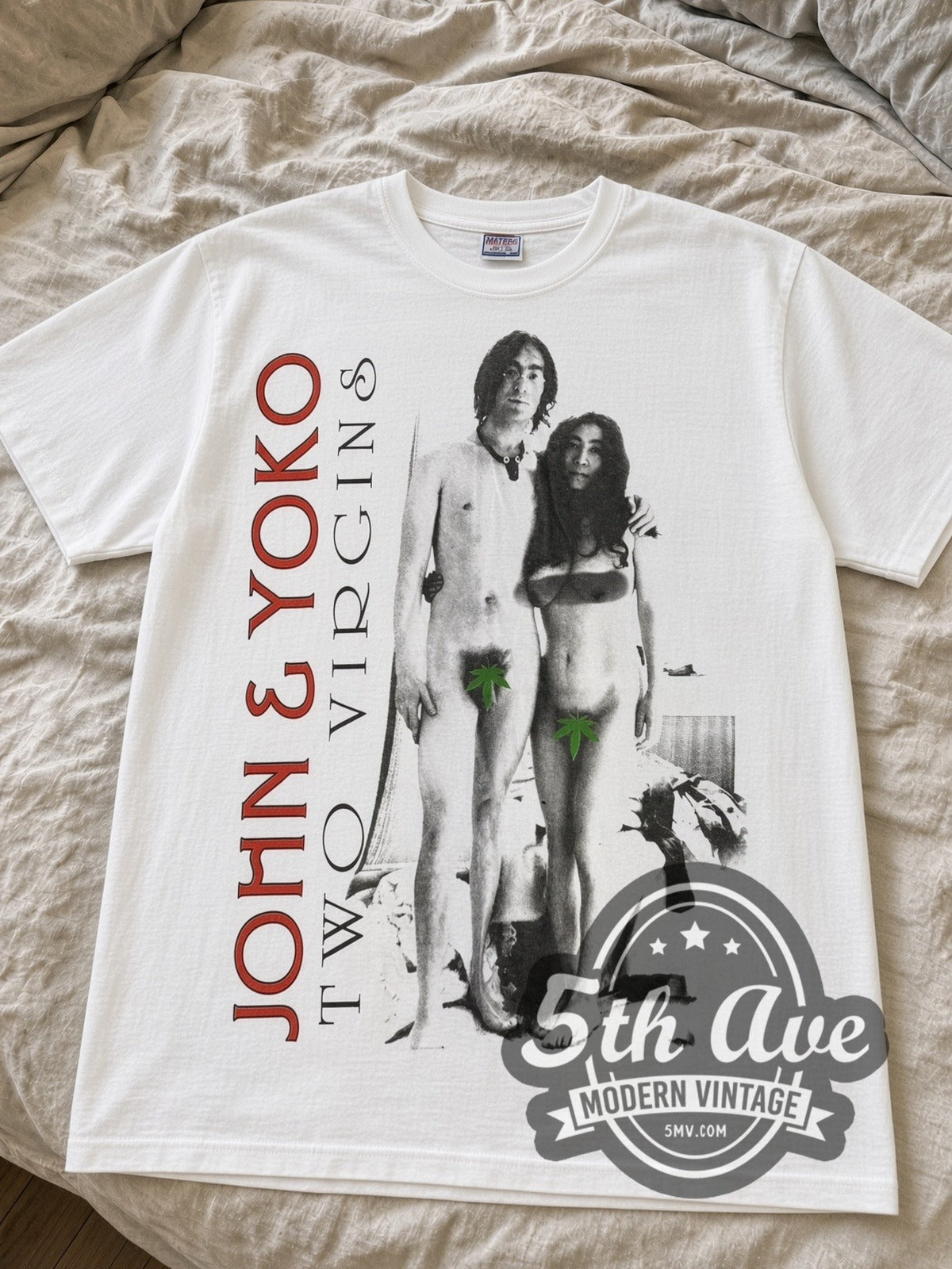 White John & Yoko Two Virgins tee laid flat on linen bed