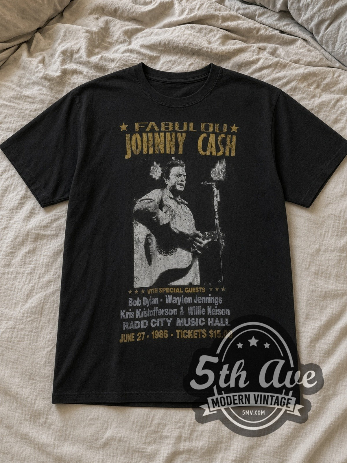 Black Johnny Cash Radio City 1986 Vintage Band T-Shirt laid flat on a linen bed