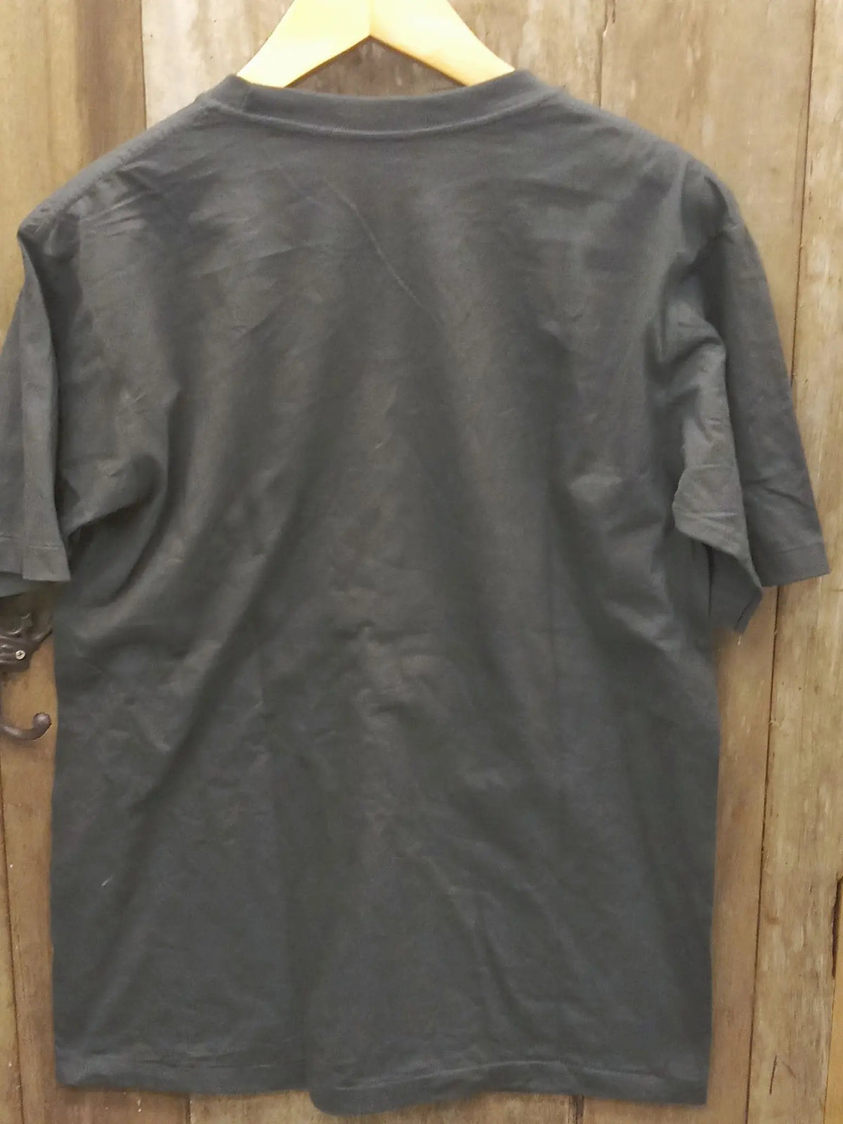 Vintage-Inspired Joy Division 'Unknown Pleasures' Graphic T-Shirt vintage t-shirt laid on bed