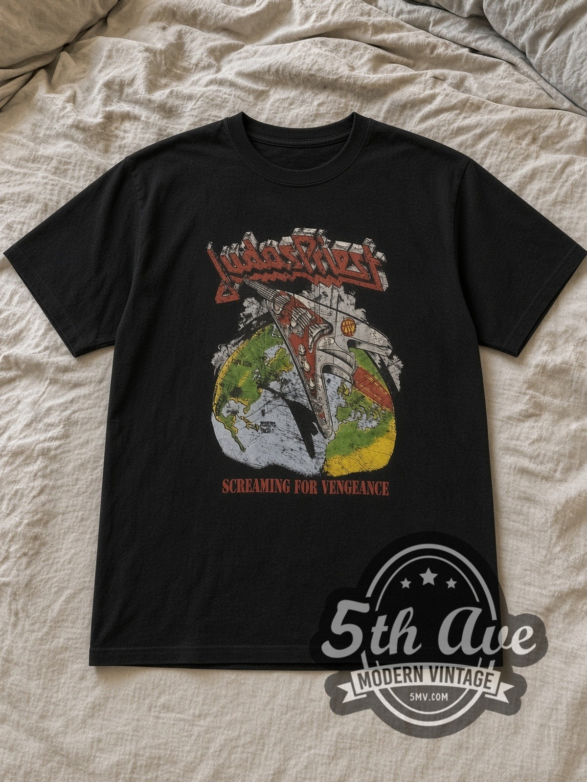 Black Judas Priest Point of Entry' Electric Guitar Vintage Band T-Shirt laid flat on a linen bed