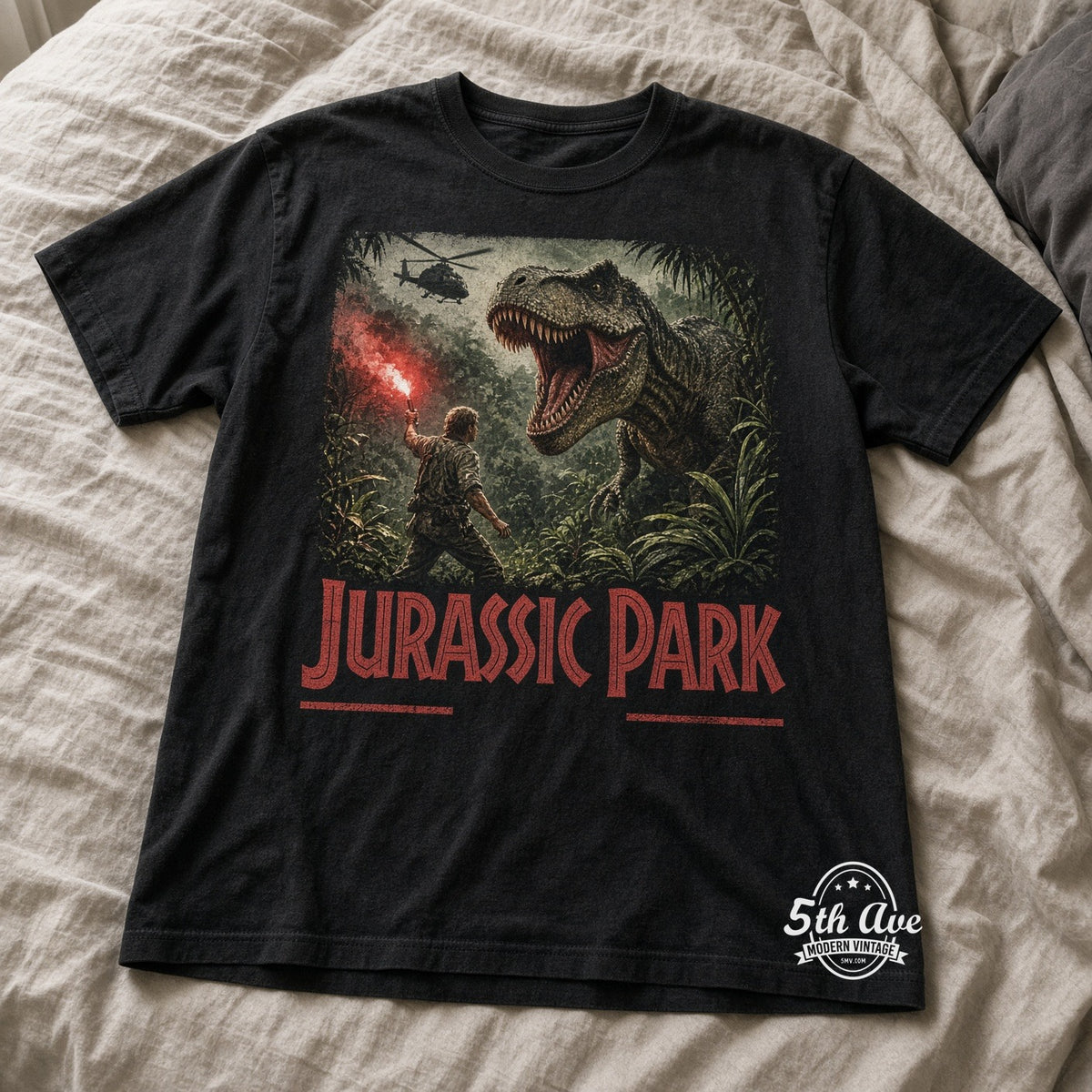 Jurassic Park T-Rex flare vintage t-shirt laid on bed