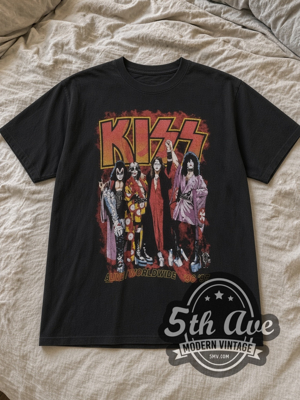 Black KISS Alive Worldwide Tour Vintage Band T-Shirt laid flat on a linen bed