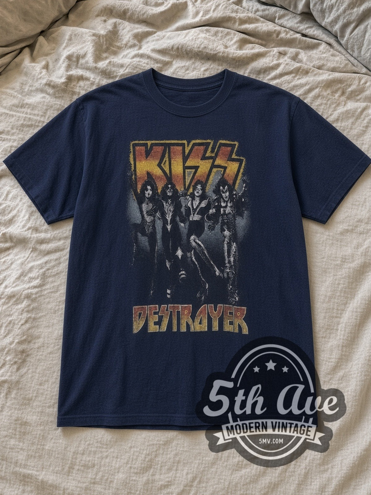 Navy KISS Destroyer Vintage Band T-Shirt laid flat on a linen bed