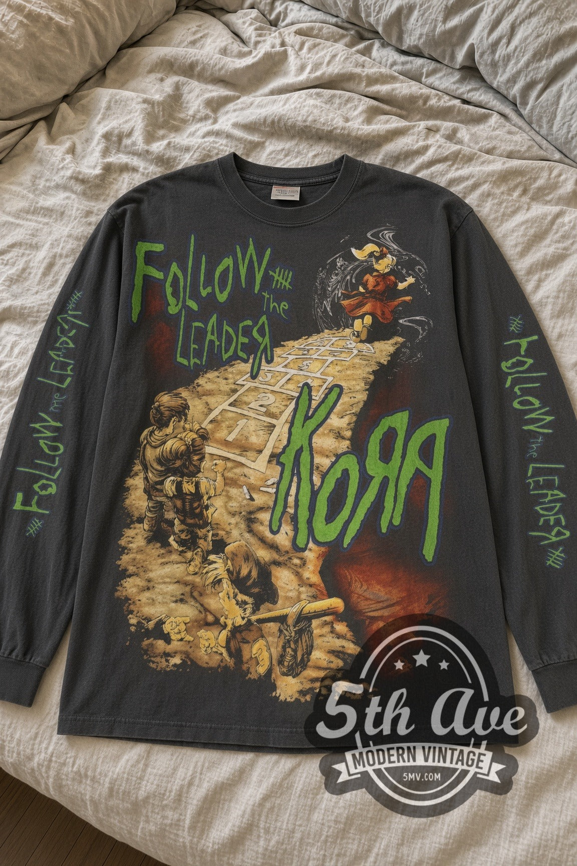 Korn Follow the Leader Hopscotch and Band Photo Long Sleeve vintage band t-shirt laid flat on bed