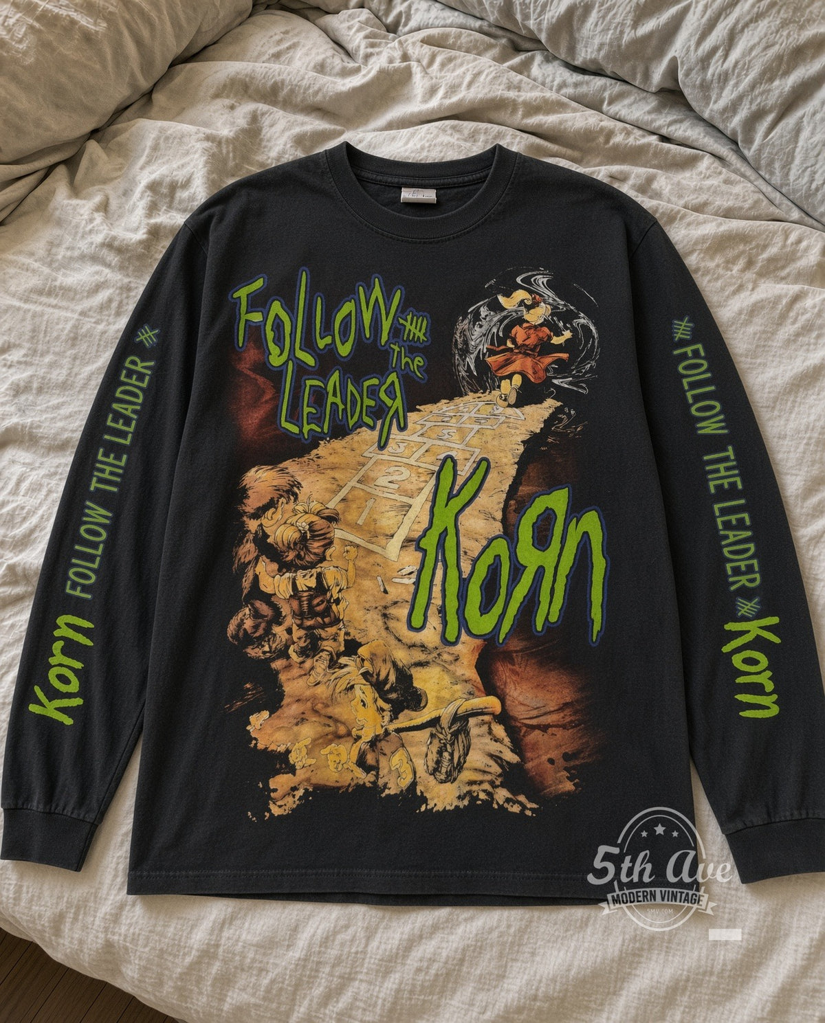 Korn Follow the Leader Hopscotch and Band Photo Long Sleeve vintage band t-shirt laid flat on bed