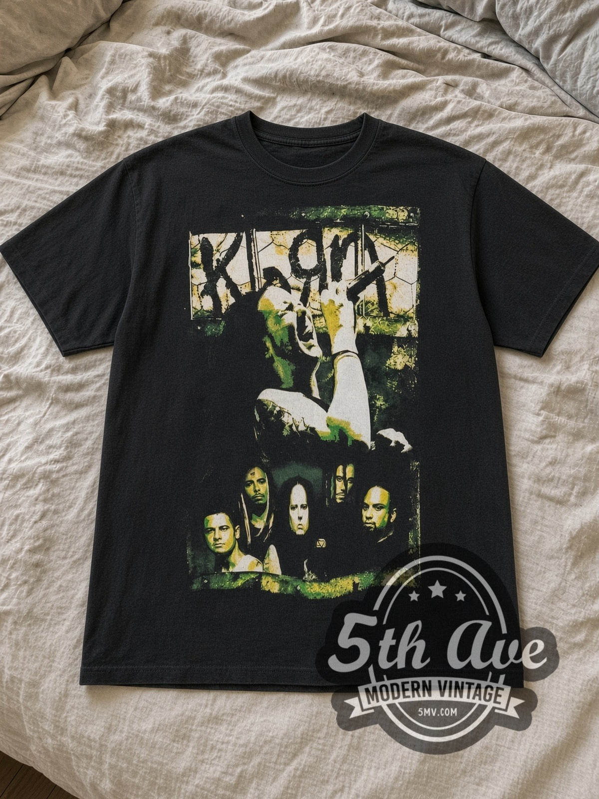 Black Korn Vintage Band T-Shirt laid flat on a linen bed