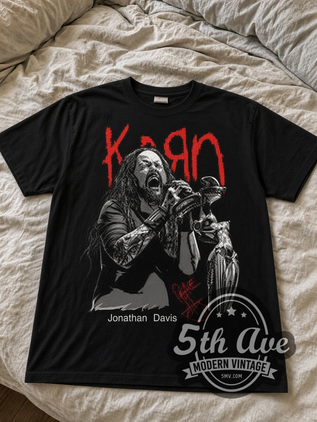 Korn Jonathan Davis at Mic black graphic tee laid flat on linen bed