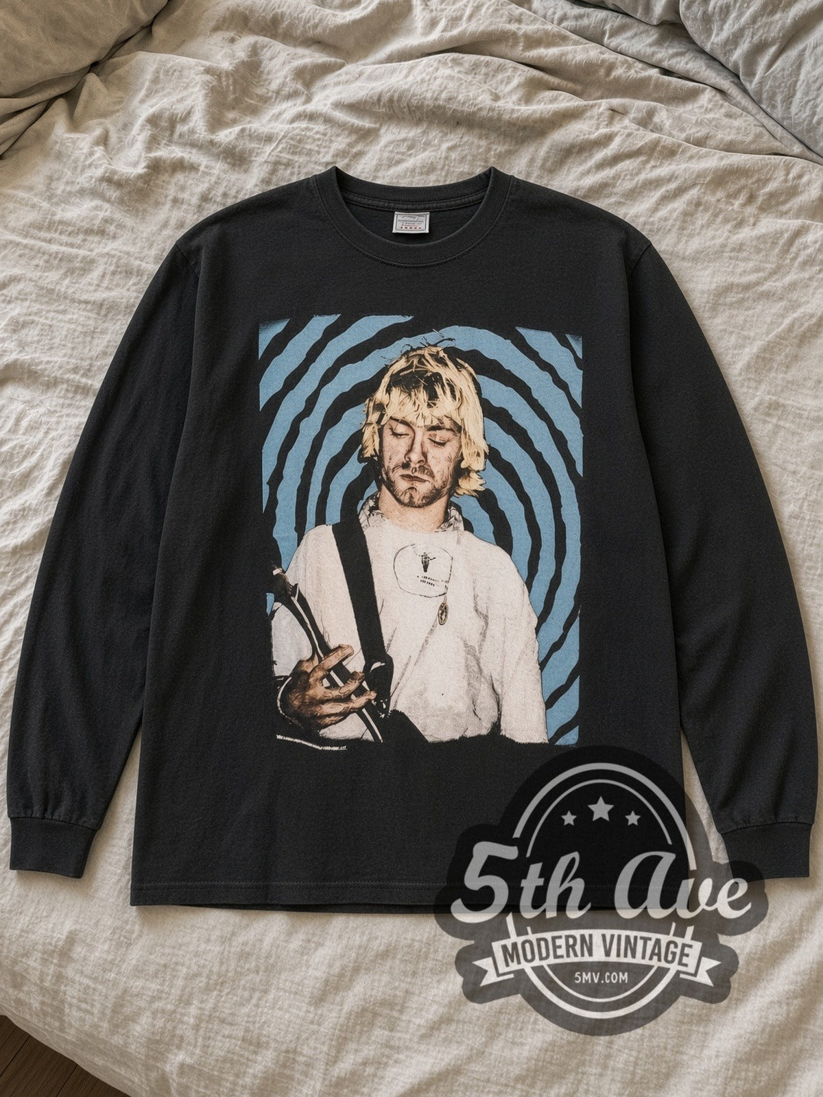 Black Nirvana Downward Spiral Vintage Band Long Sleeve T-Shirt laid flat on a linen bed