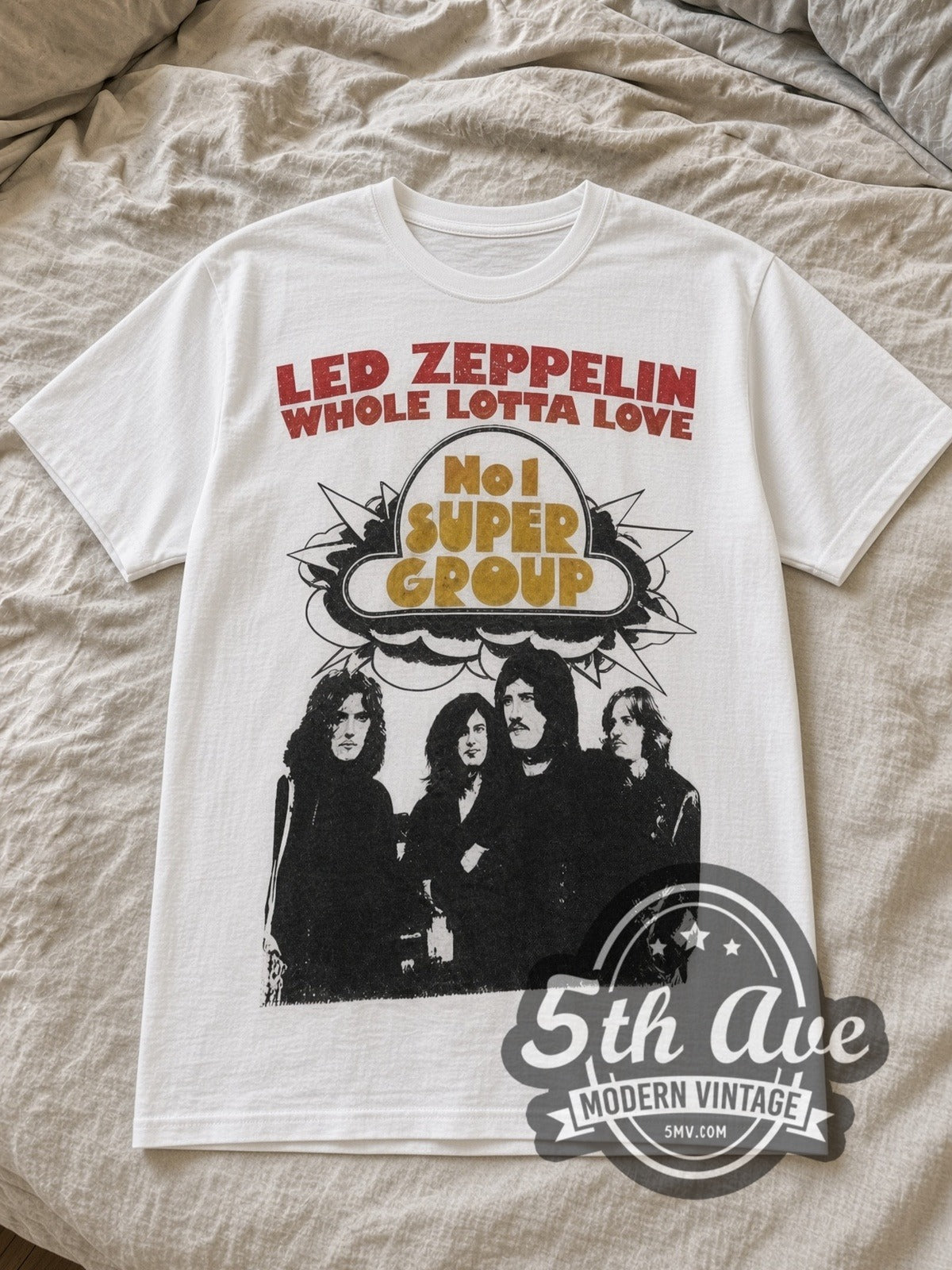 White Led Zeppelin Whole Lotta Love White Vintage Band T-Shirt laid flat on a linen bed