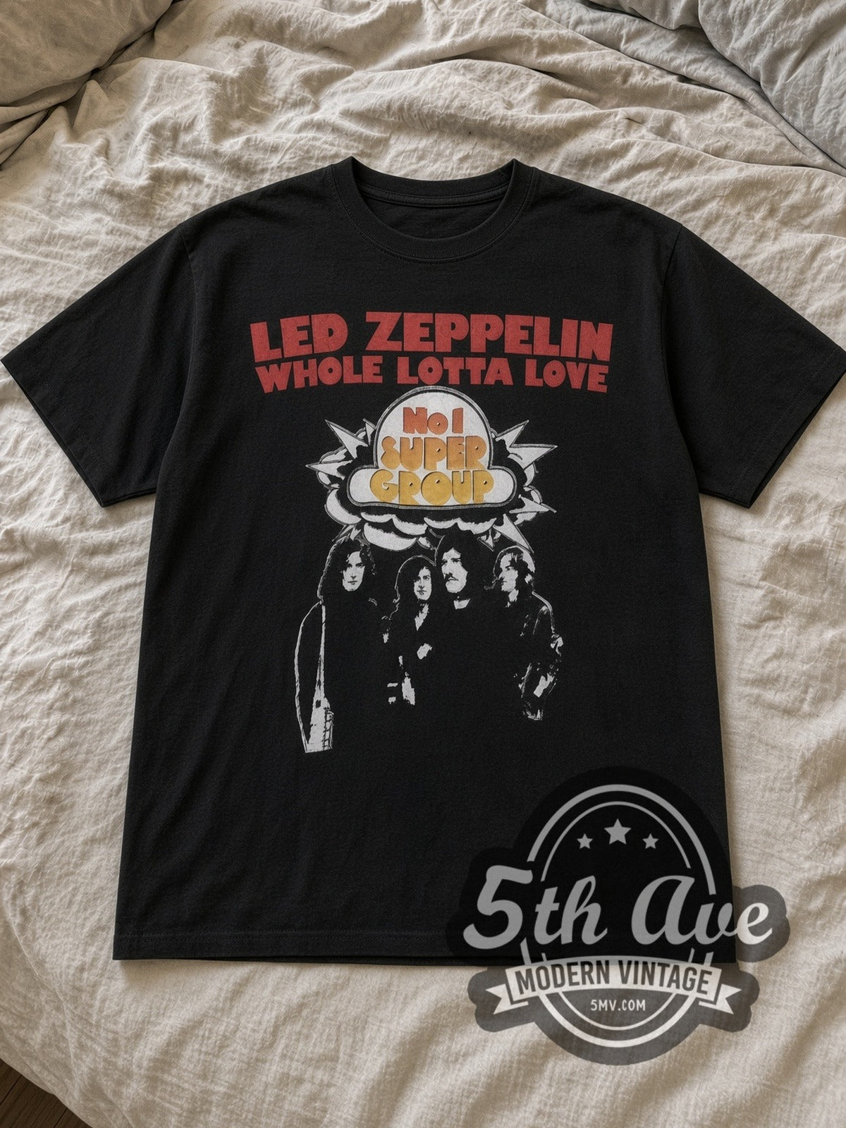 Black Led Zeppelin Whole Lotta Love Vintage Band T-Shirt laid flat on a linen bed