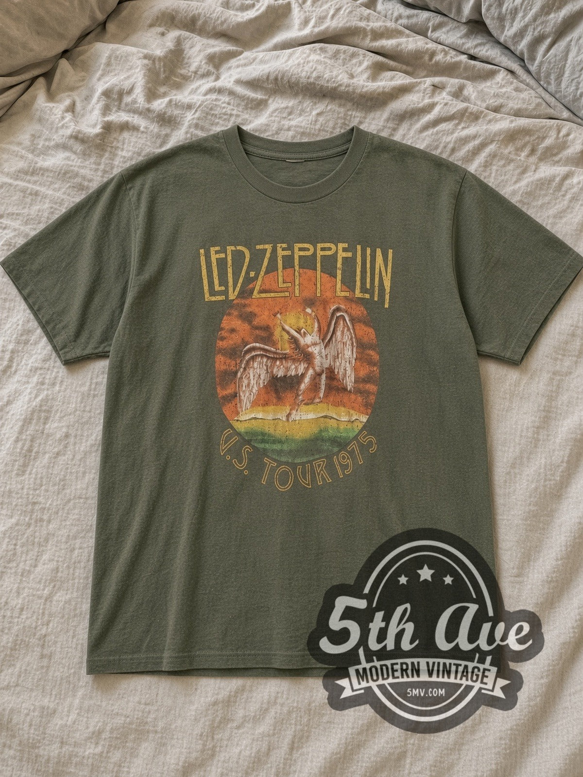 Olive Led Zeppelin US Tour 1975 Vintage Band T-Shirt laid flat on a linen bed