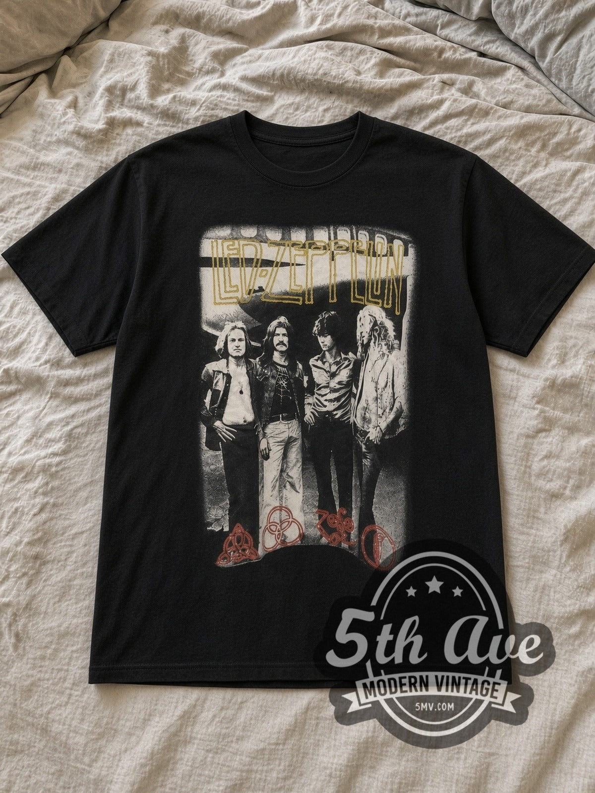 Black Led Zeppelin Tribute with Zoso Logos Vintage Band T-Shirt laid flat on a linen bed