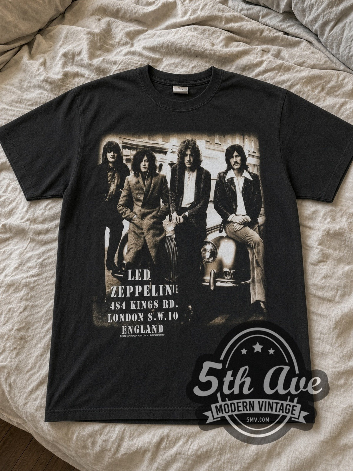 Led Zeppelin Starship Jet & Kings Rd Photo band t-shirt in black laid flat on a bed, front artwork