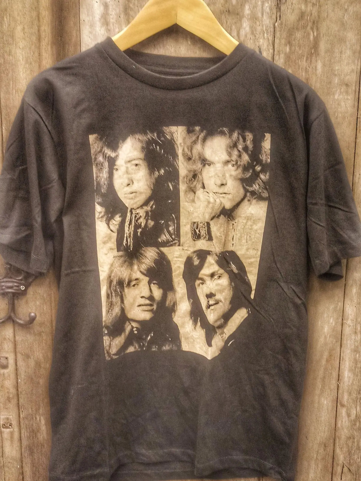 Led Zeppelin Vintage Band Members T-Shirt: A Nostalgic Tribute to Rock Legends vintage band t-shirt on rack