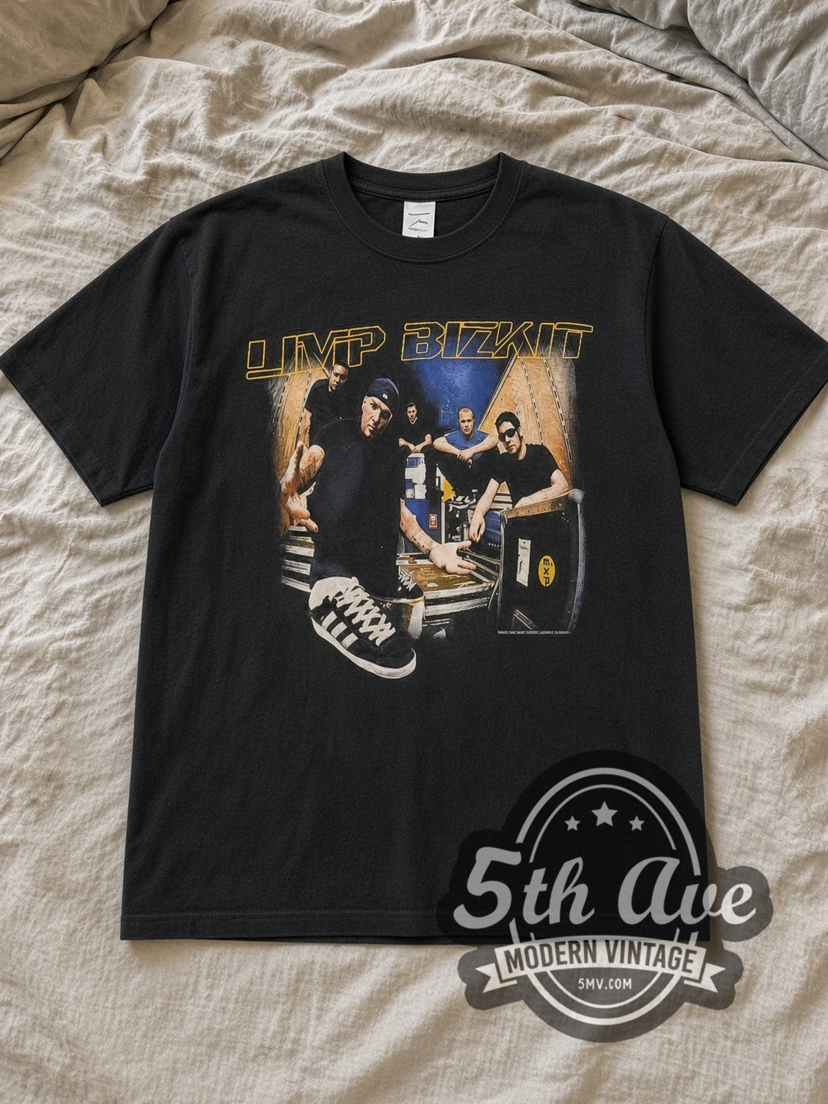 Black Limp Bizkit Chocolate Starfish Tour Vintage Band T-Shirt laid flat on a linen bed