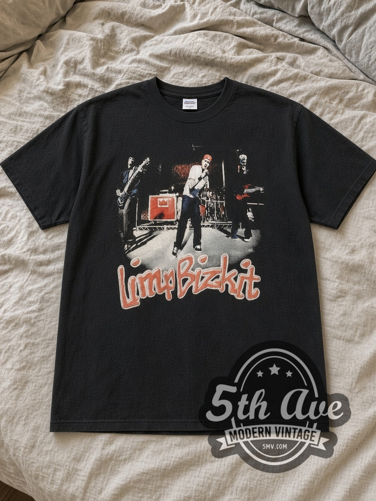Black Limp Bizkit Nookie Vintage Band T-Shirt laid flat on a linen bed