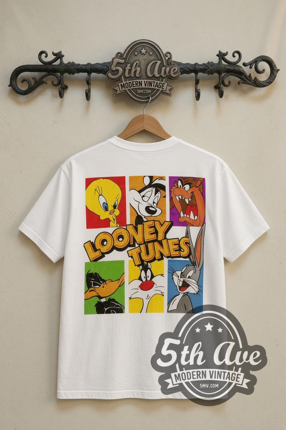 Looney Tunes 33 USA Stamp Tweety Sylvester cartoon tee in white, back view on a display rack