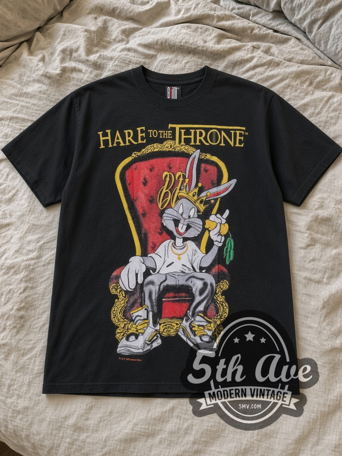 Black Bugs Bunny Hare Throne Vintage Cartoon T-Shirt laid flat on a linen bed