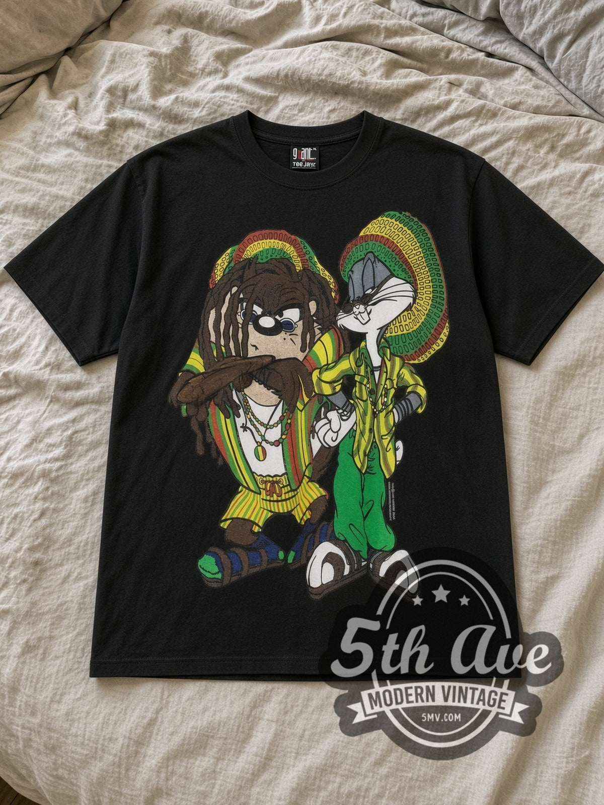 Black Looney Tunes Rasta Bugs Bunny and Tasmanian Devil Vintage Cartoon T-Shirt laid flat on a linen bed