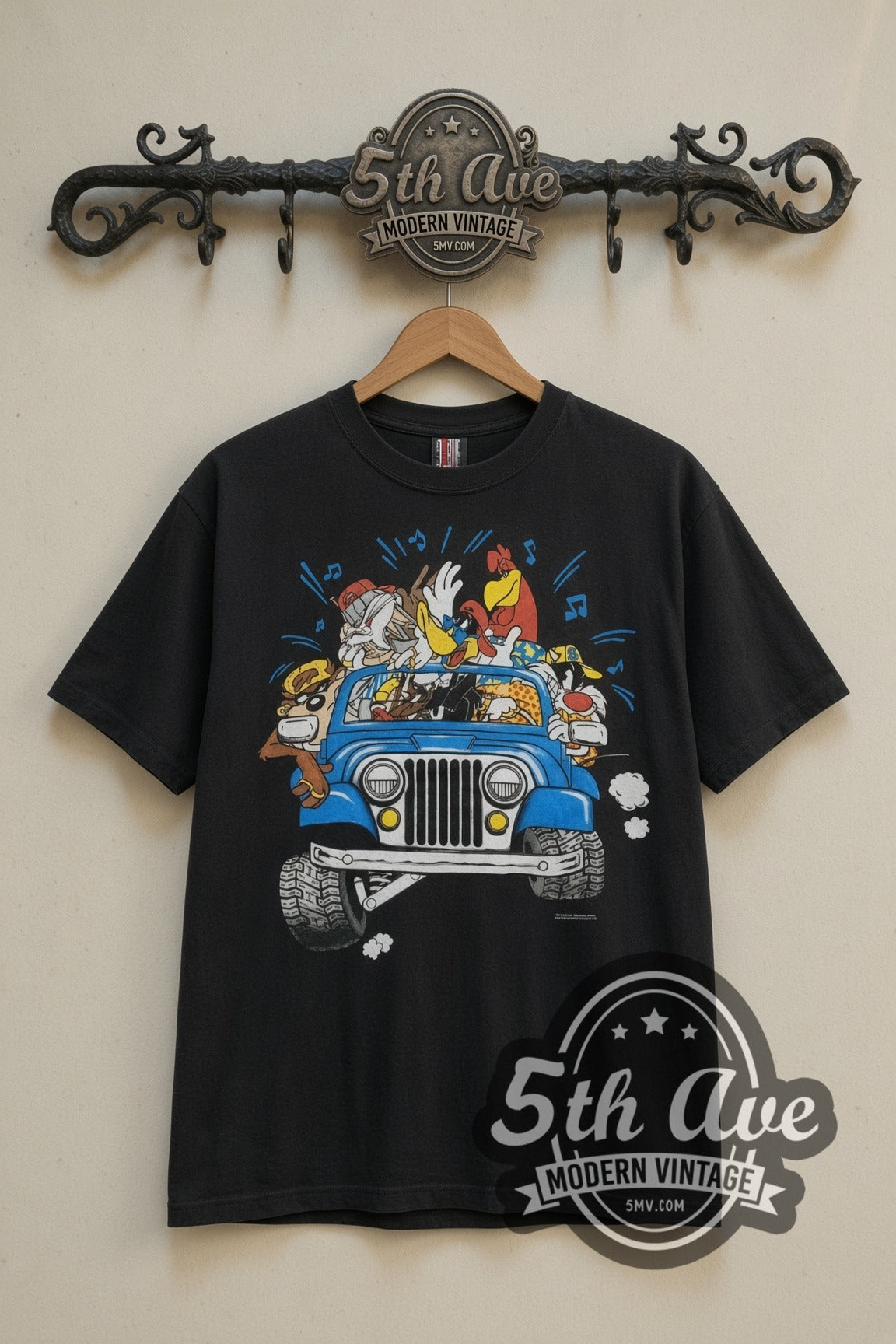 Looney Tunes Jeep Road Trip cartoon tee in black, front view on a display rack