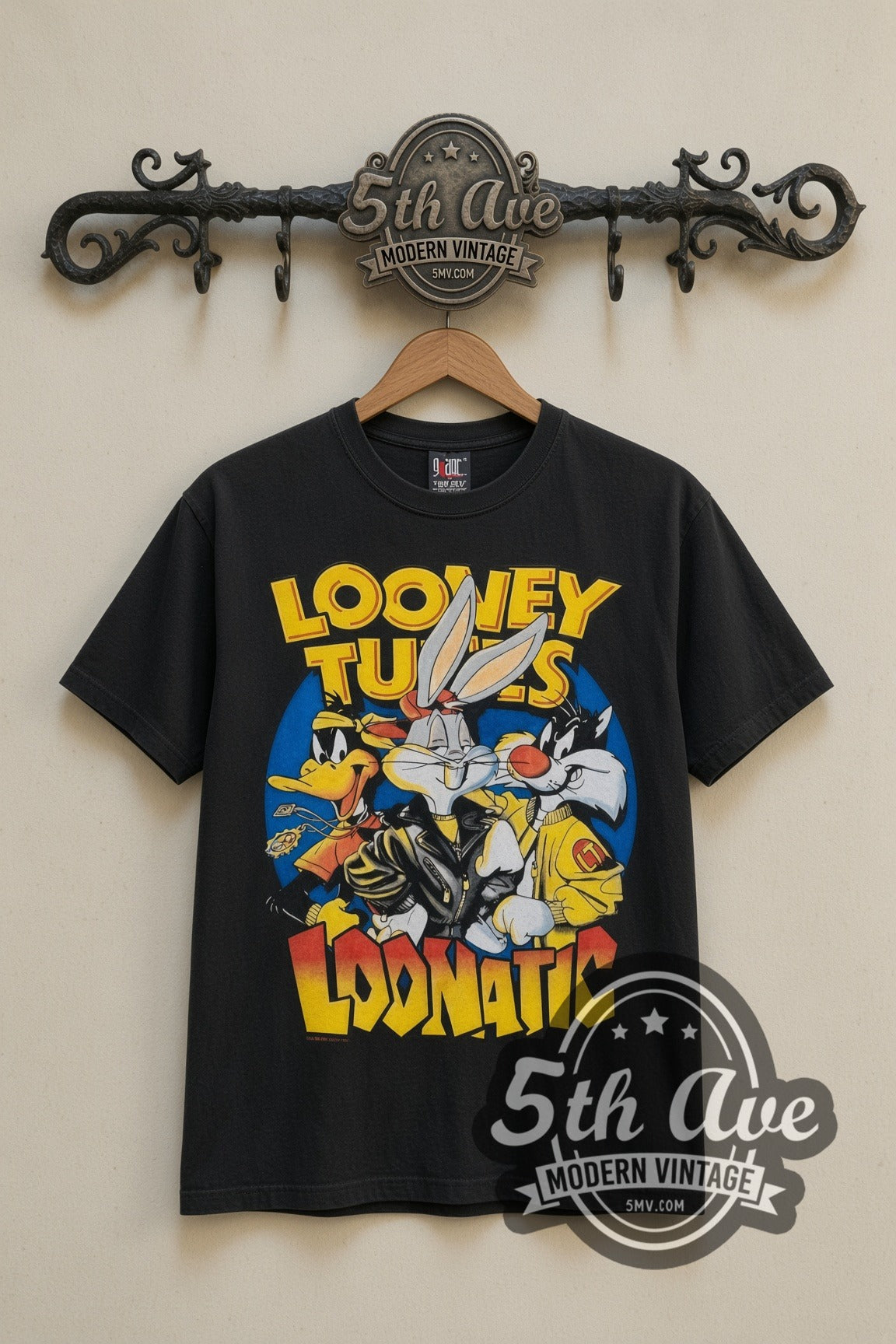 Looney Tunes Loonatic Biker Circle cartoon tee in black, front view on a display rack