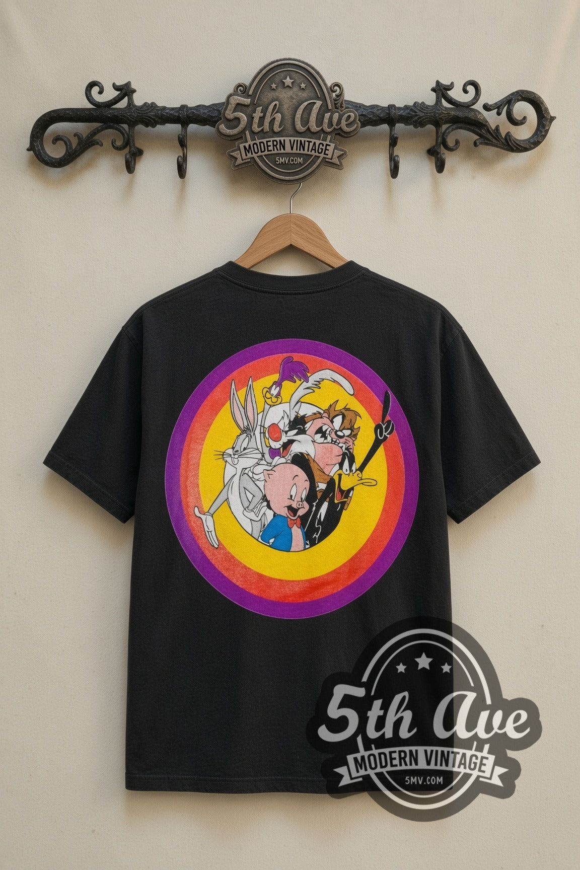 Looney Tunes Loonatic Biker Circle cartoon tee in black, back view on a display rack