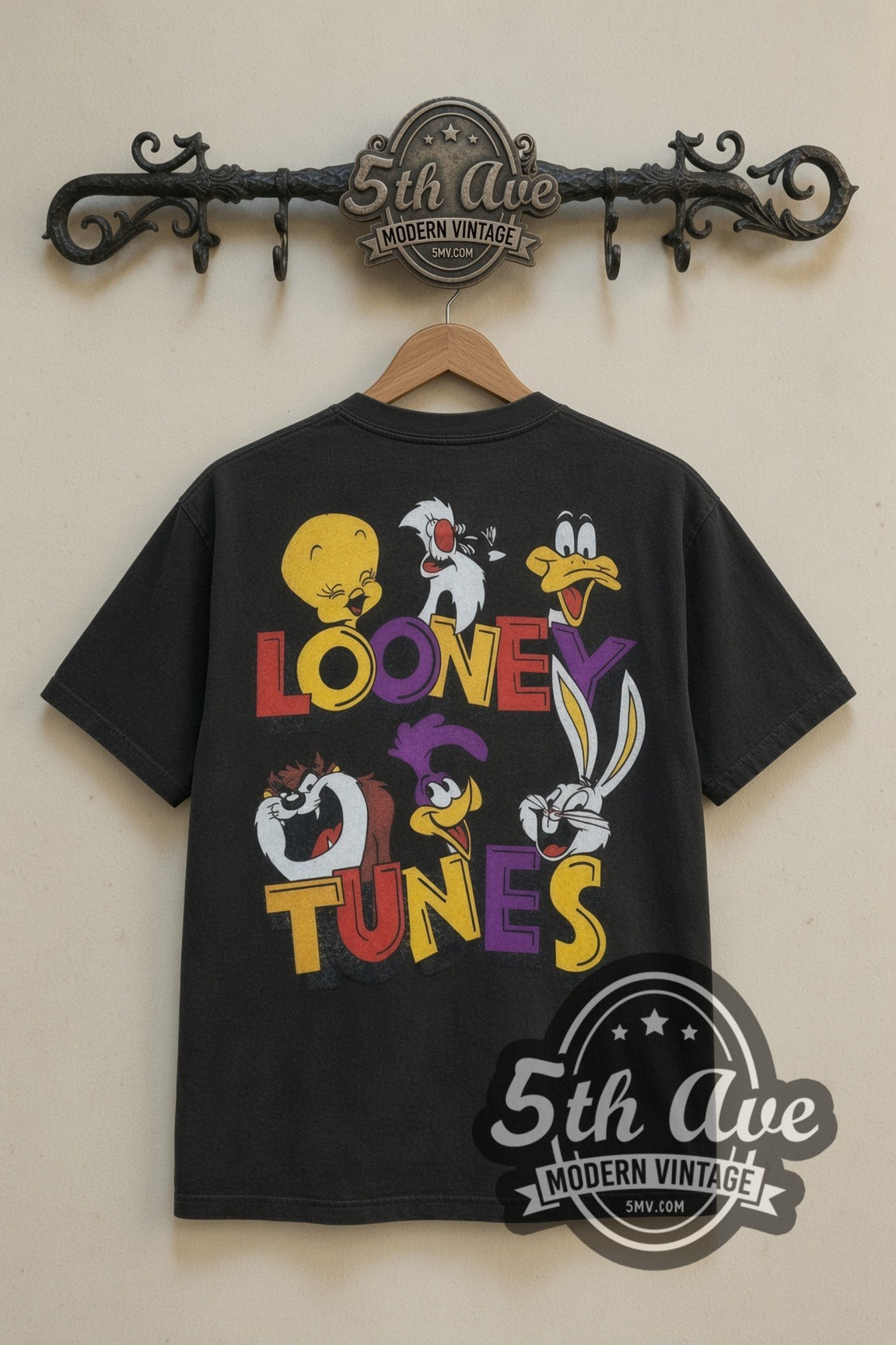 Looney Tunes Loonatic Circle Crest cartoon tee in black, back view on a display rack