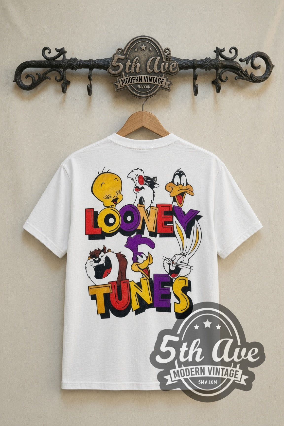 Looney Tunes Loonatic Circle Crest cartoon tee in white, back view on a display rack