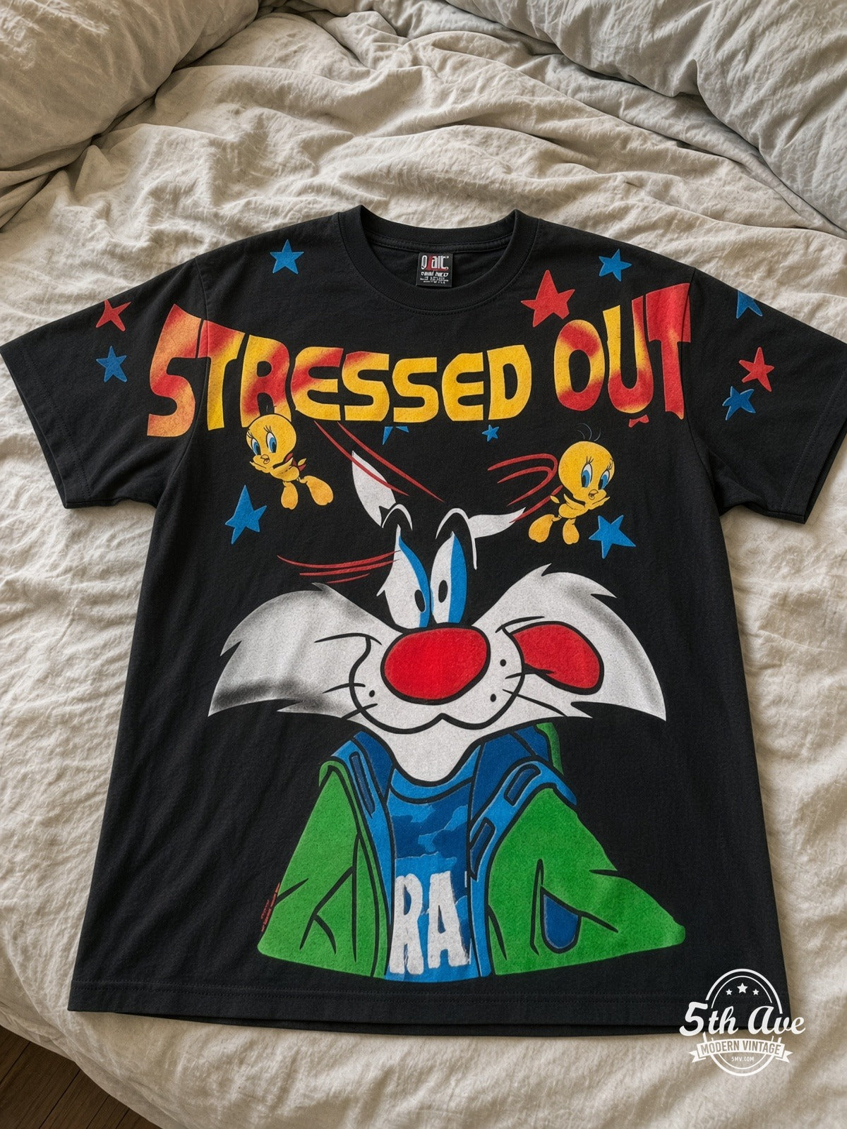 Looney Tunes Sylvester Tweety Stressed Out vintage tee laid on bed