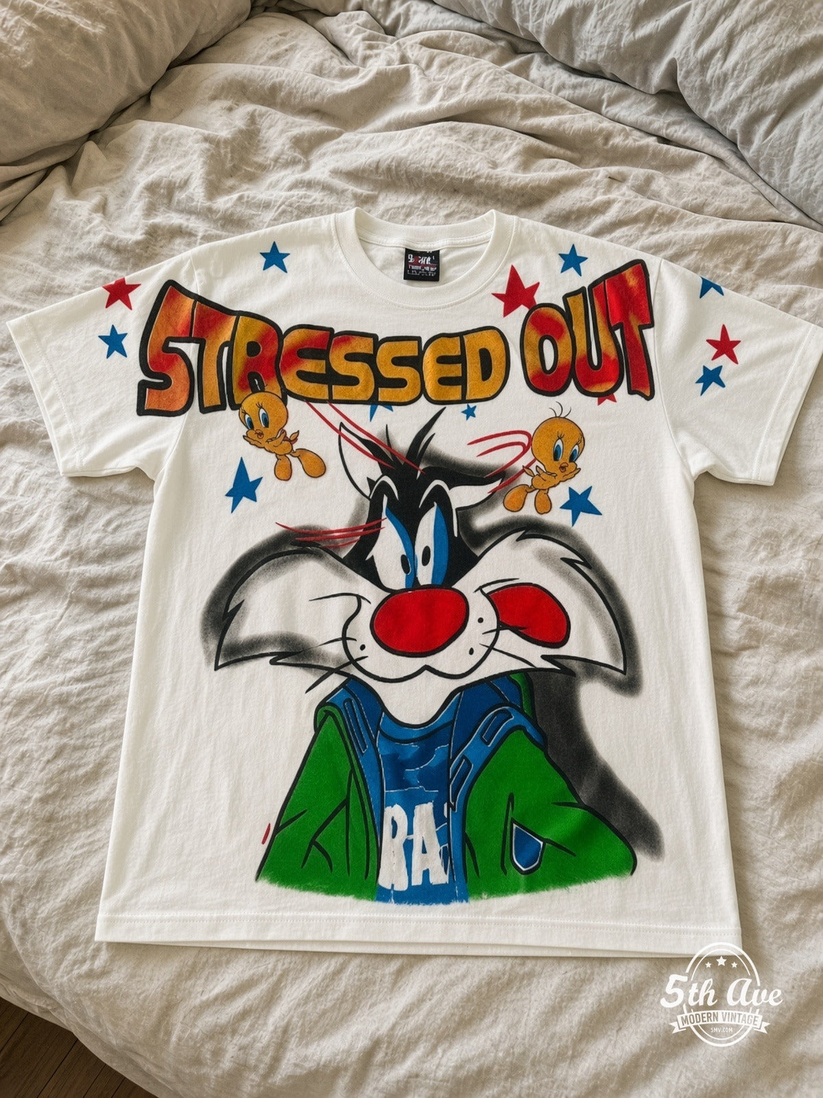 Looney Tunes Sylvester Tweety Stressed Out vintage tee laid on bed