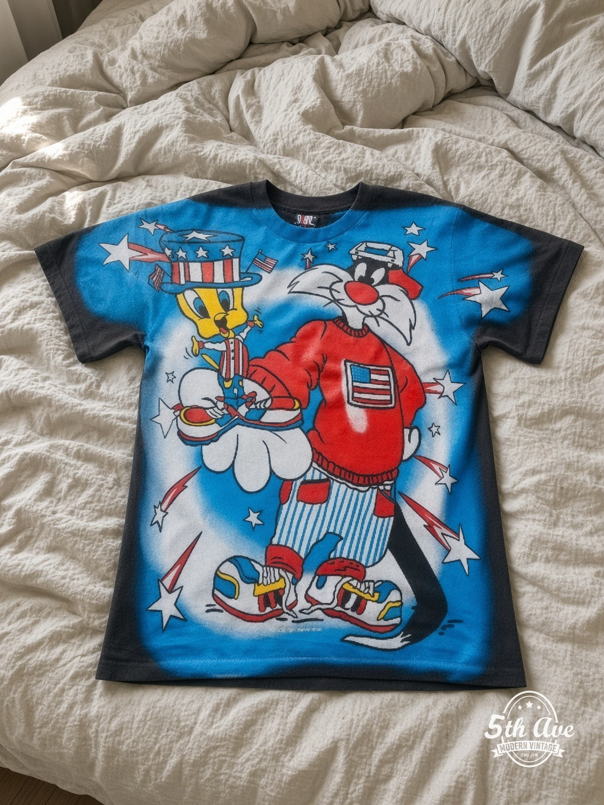 Looney Tunes Sylvester Uncle Sam Patriotic vintage tee laid on bed