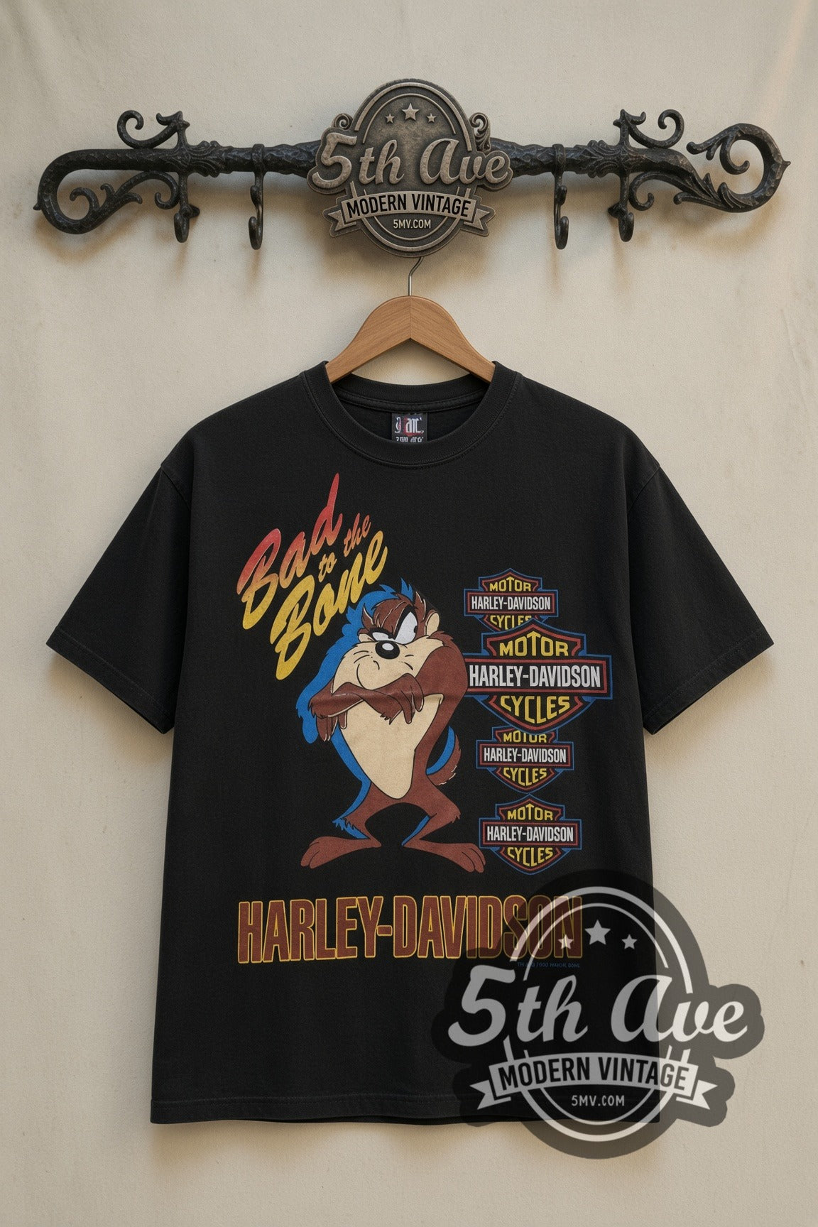 Looney Tunes Taz Bad to the Bone Harley cartoon tee in black, front view on a display rack