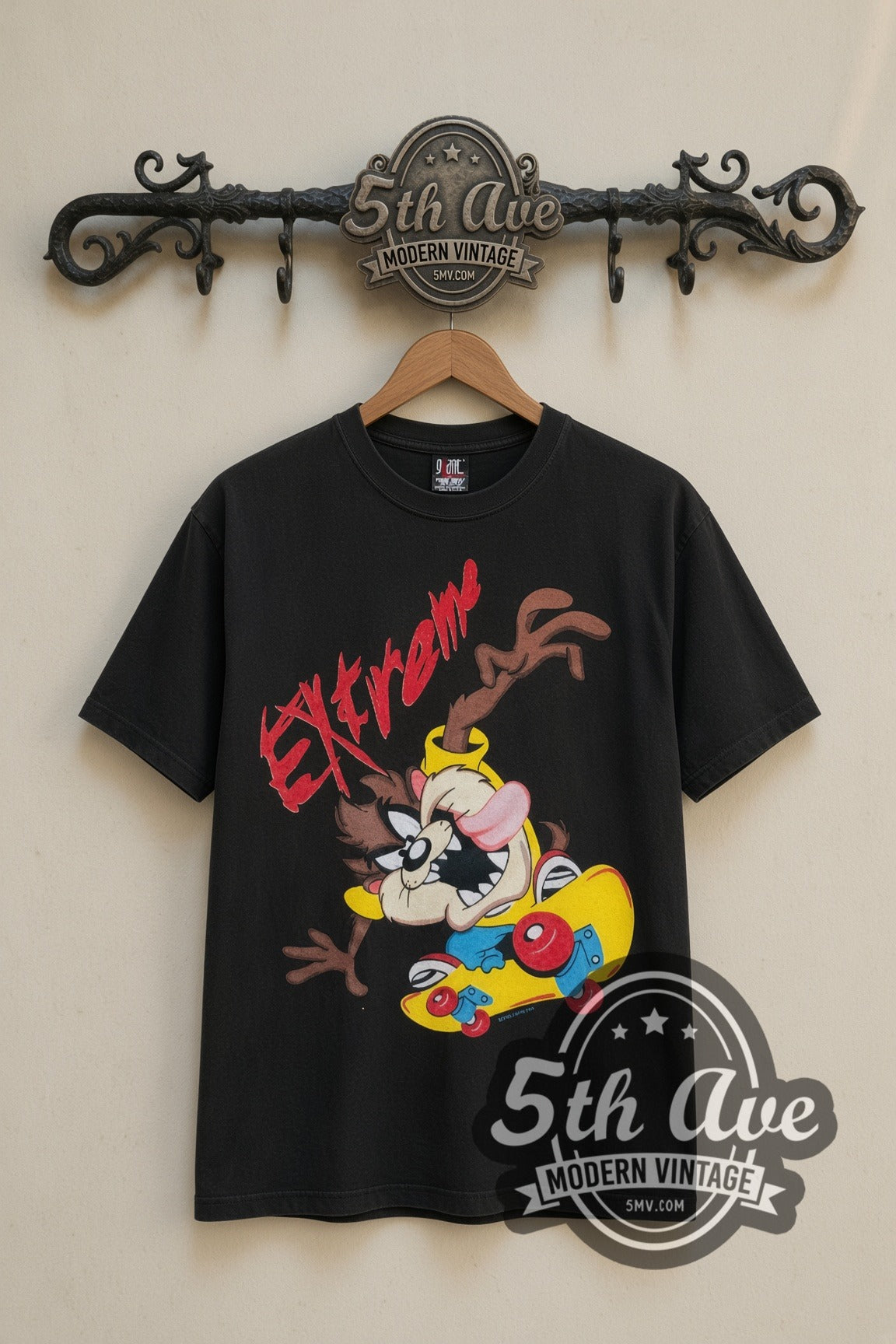 Looney Tunes Taz Extreme Skate cartoon tee in black, front view on a display rack