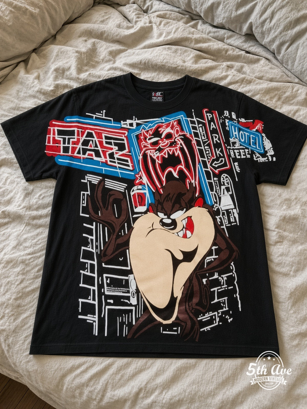 Looney Tunes Taz Graffiti Street vintage tee laid on bed