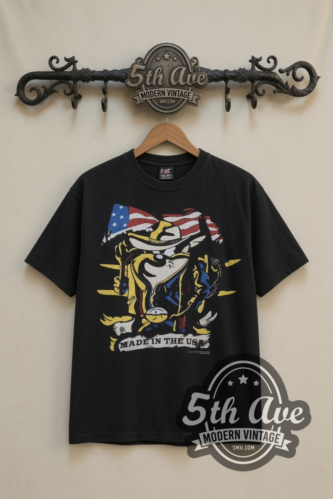 Looney Tunes Taz Made in the USA Cowboy Flag cartoon tee in black, front view on a display rack