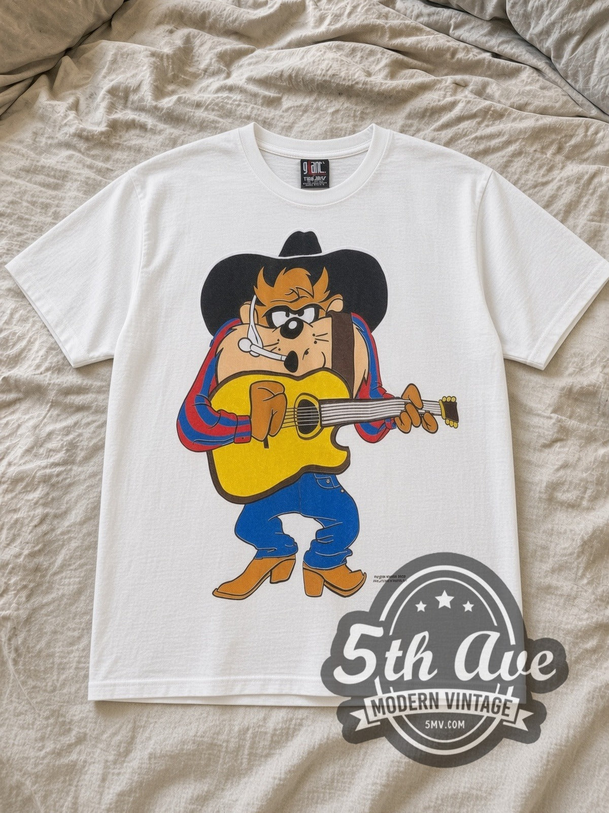 White Looney Tunes Garth Brooks Taz Mania Vintage Cartoon T-Shirt laid flat on a linen bed