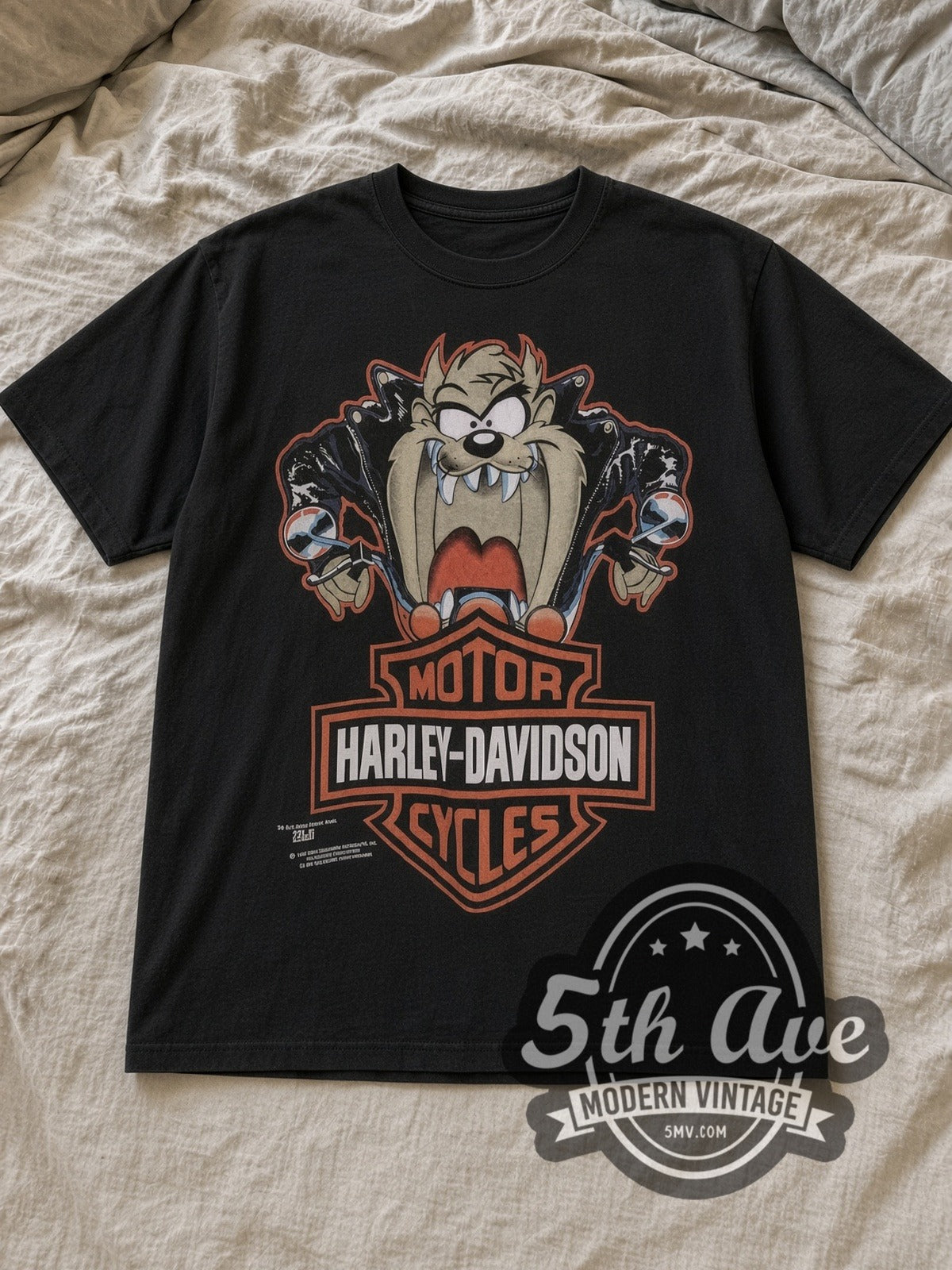 Black Looney Tunes Taz Vintage Harley-Davidson T-Shirt laid flat on a linen bed