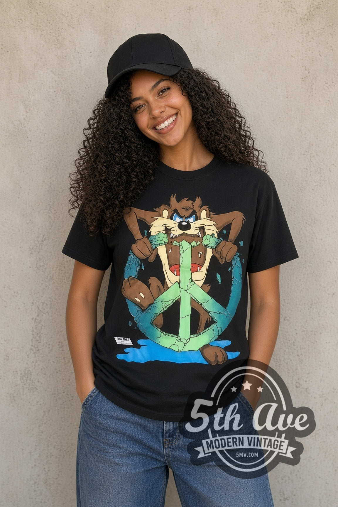 Model wearing the Looney Tunes Taz Peace Sign cartoon tee in black