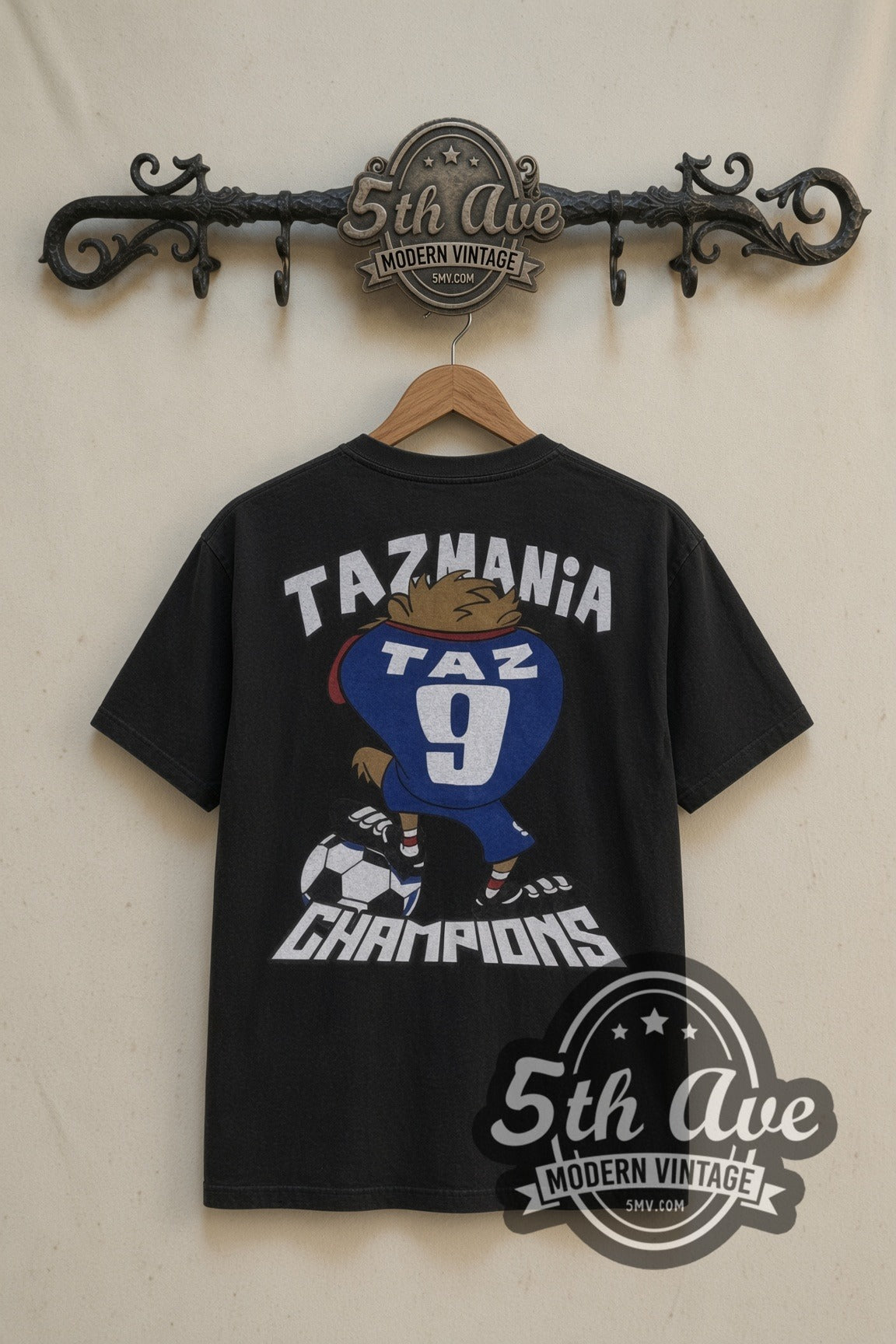 Looney Tunes Taz Soccer Champions cartoon tee in black, back view on a display rack