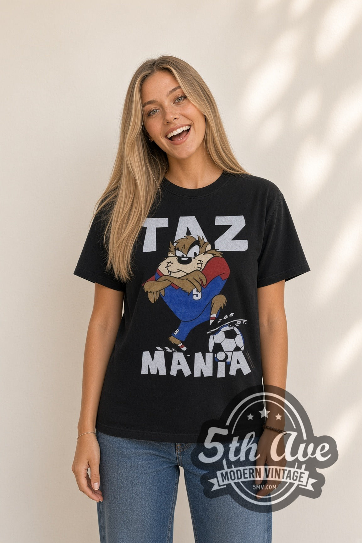 Model wearing the Looney Tunes Taz Soccer Champions cartoon tee in black