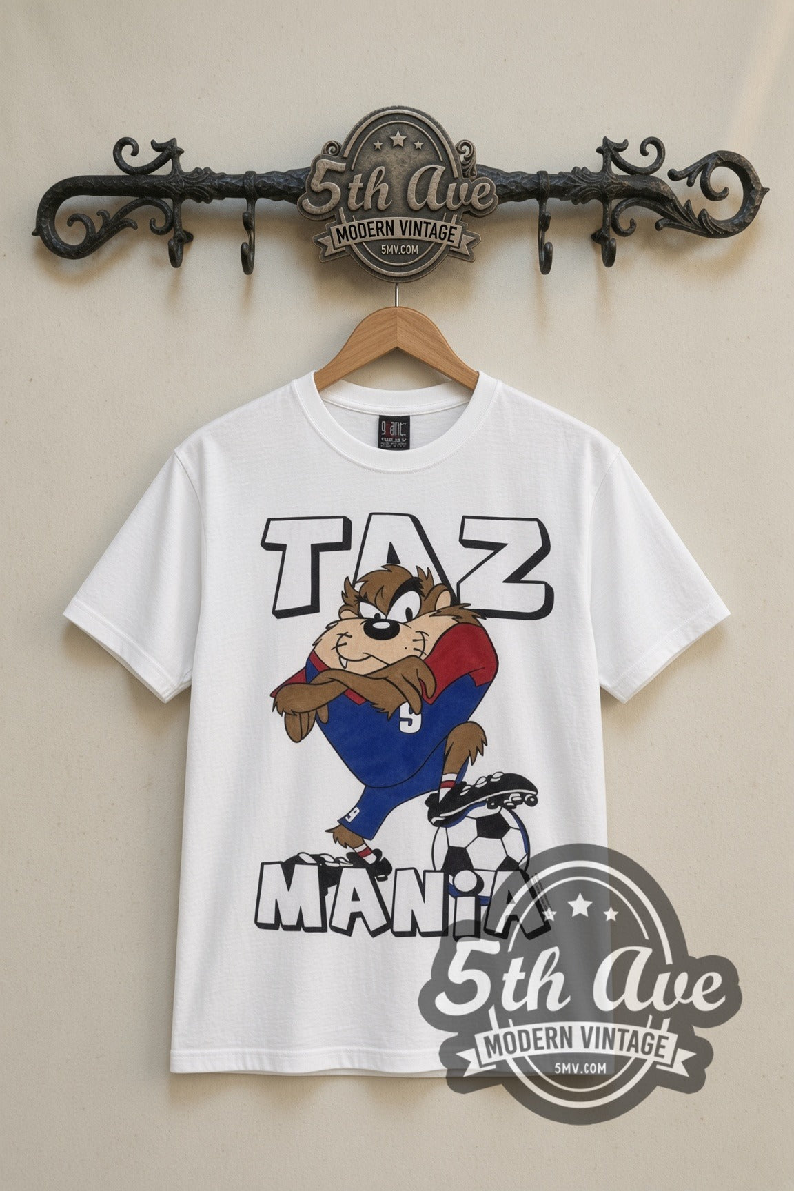 Looney Tunes Taz Soccer Champions cartoon tee in white, front view on a display rack