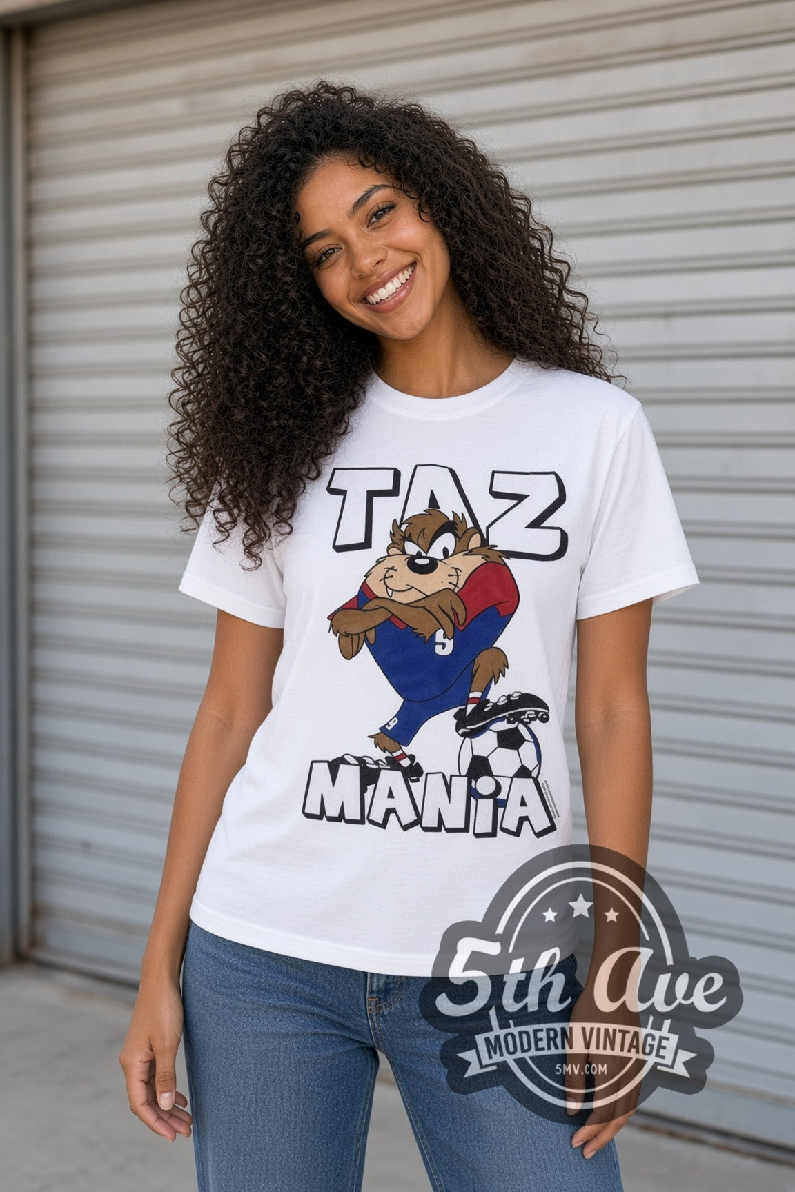 Model wearing the Looney Tunes Taz Soccer Champions cartoon tee in white