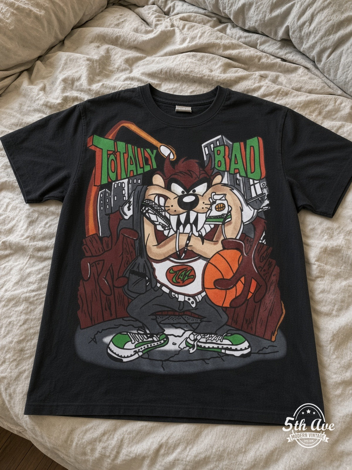 Looney Tunes Taz Totally Bad Hip-Hop vintage tee laid on bed