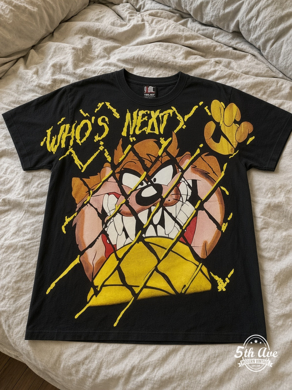 Looney Tunes Taz Who's Next vintage tee laid on bed