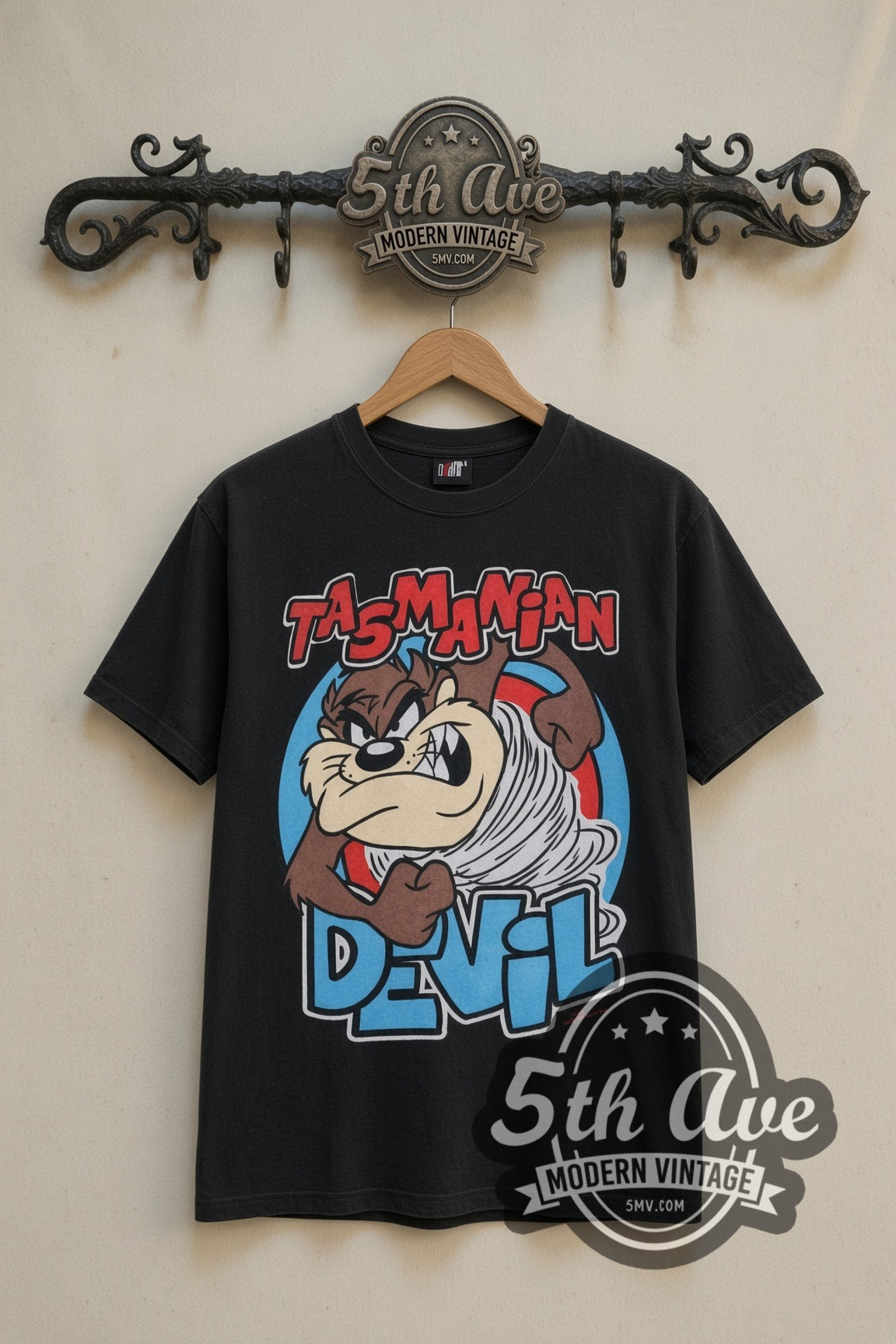 Looney Tunes Taz's Gym No Pencilnecks cartoon tee in black, front view on a display rack